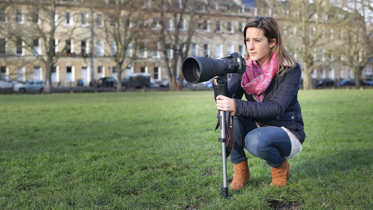 Woman using a monopod in a park