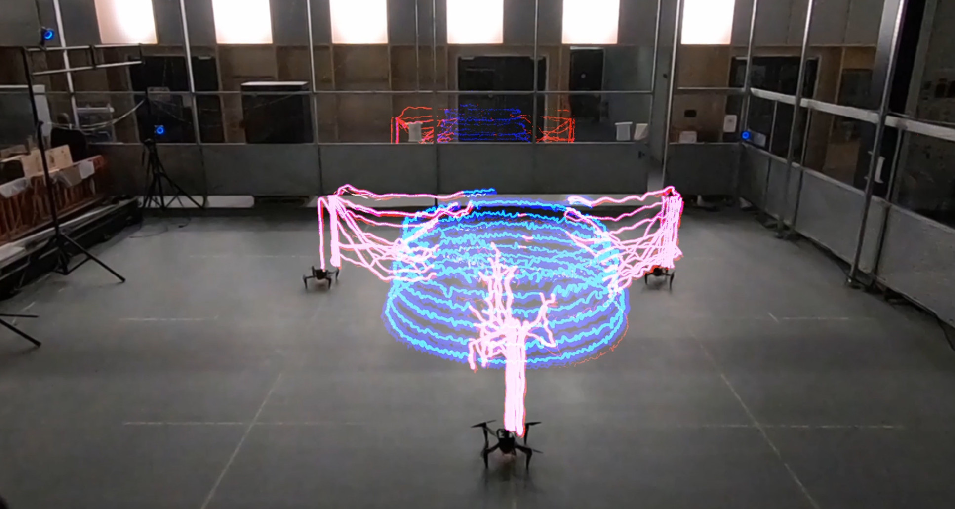 Timelapse light trace demonstrating multi-agent coordination of Aerial AM robot team.